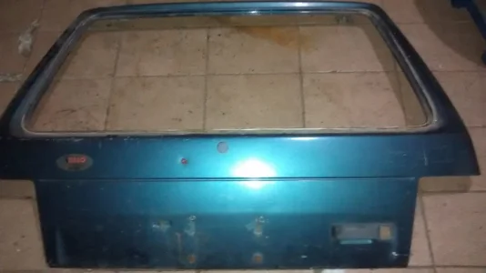 Tampa Trazeira Uno